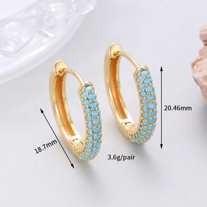 Detail view of gold hoop earrings with turquoise beads showing 20.46mm dimensions