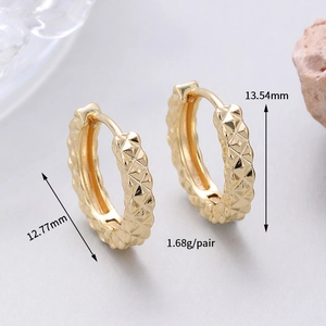 Detail of gold hoop earrings with diamond-cut texture, inner diameter 12.77mm, weight 1.68g
