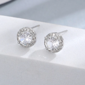 Minimalist S925 sterling silver halo stud earrings featuring round cubic zirconia stones