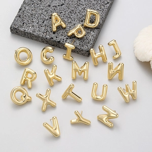 Glossy golden bubble alphabet stud earrings with minimalist 3D letter charms on stones