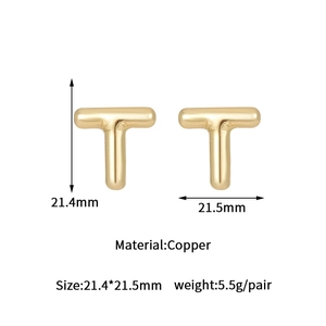 Macro view of gold bubble letter T earrings with dimensions 21.4mm by 21.5mm