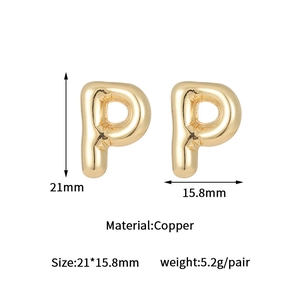 Detailed view of golden bubble P shape earrings with size measurements in copper material