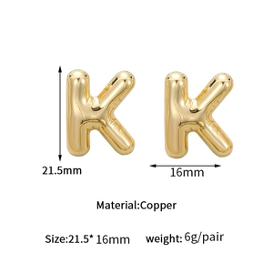 Polished gold bubble letter K earrings in copper with dimensions and weight detail