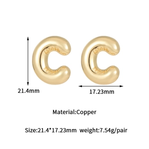 Detailed specs of gold bubble letter C earrings in high-polished brass finish
