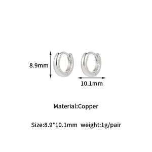 Detail view of 14K gold-plated huggie earrings showing size dimensions and copper material