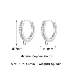 Detailed view of 14k gold-plated huggie hoop earrings with cubic zirconia and DIY loops