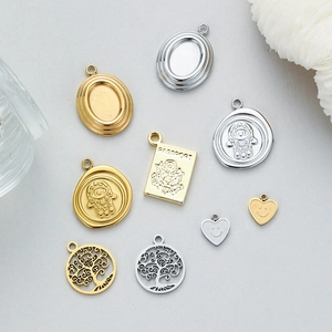 Collection of gold and silver plated Tree of Life and Evil Eye stainless steel charms