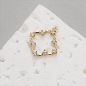 Detail of gold-plated square flower hollow pendant with sparkling zircon for DIY jewelry
