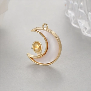 Golden crescent moon pendant with white shell inlay and pearl setting for DIY jewelry