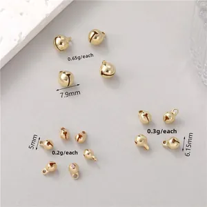 Polished 14K gold plated brass bell pendants in various sizes for DIY jewelry making