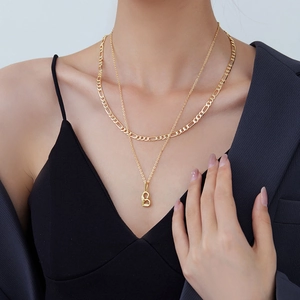 Double-layered gold necklace set with Figaro chain and artistic letter B pendant