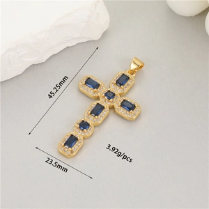 Detail of 14K gold cross pendant with blue stones and dimensions 45.25mm by 23.5mm