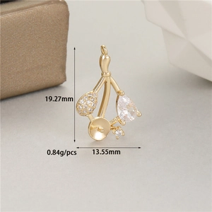 Detail of 14K gold plated cherry jewelry pendant with cubic zirconia and pearl cup