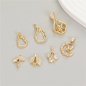 Detailed view of 14K gold plated zircon rabbit and leaf shaped pearl pendant settings