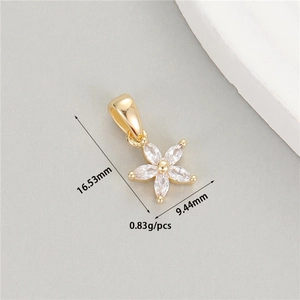 Macro view of gold flower pendant with marquise zircons showing 16.53mm height detail