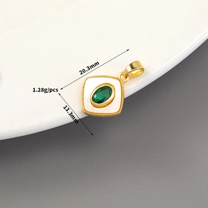 Detailed macro view of 14K gold plated square pendant with shell inlay and green gem