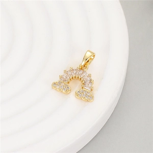 Gold rainbow pendant charm with baguette-cut cubic zirconia and sparkling pavé clouds