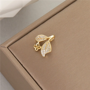 14K gold plated leaf pendant with zircon inlay on brown leather jewelry case