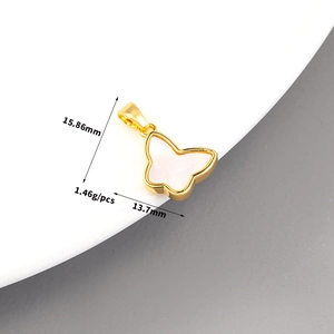 Macro detail of 14K gold butterfly pendant with shell inlay and technical dimensions