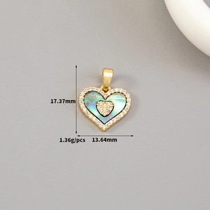 Detail of 14K gold plated heart pendant with turquoise shell inlay and zircon setting