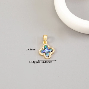 Detail view of a 14K gold plated butterfly pendant with mop shell and dimensions 19.5mm