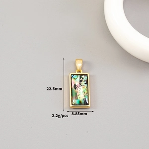 Macro detail of 14K gold plated rectangular pendant with iridescent abalone shell inlay