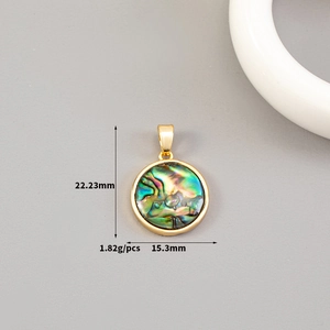 Macro view of abalone shell pendant with 14K gold frame showing size specifications