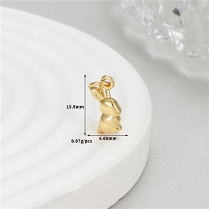 Detail view of 14K gold plated rabbit pendant with 15.9mm height and 6.08mm width measurements