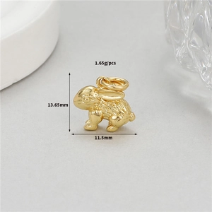 Macro shot of a 14K gold plated rabbit pendant for DIY jewelry making accessories