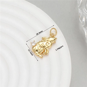 Detail view of 14K gold plated rabbit pendant with white zircon and heart engraving