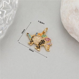 Detailed view of a stegosaurus charm in 14K gold with multi-color zircon stones