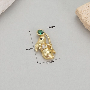 Macro shot of gold rabbit pendant with green gemstone and dimensions 21.1mm x 11.1mm