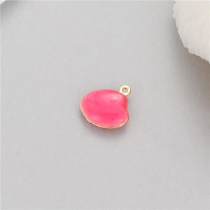 Macro view of pink shell pendant with 14k gold plating and fine seashell textures