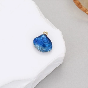 Macro view of blue gradient scallop shell pendant with 14k gold plated loop for DIY jewelry