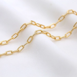 Detailed view of warm gold paperclip chain link for DIY jewelry making and crafts