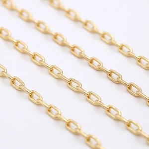 Detail shot of 14K gold plated oval cable chain with smooth polished metal finish