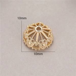 Macro detail of 10mm 14K gold-plated hollow flower bead cap for DIY jewelry making