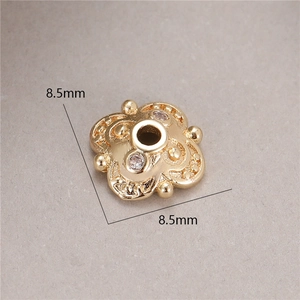 Macro shot of 8.5mm gold-plated 4-petal flower spacer bead with zircon for DIY jewelry