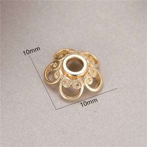 Macro shot of 10mm gold hollow petal spacer bead for DIY jewelry making material