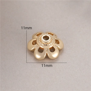 Macro shot of 11mm hollow flower bead cap in 14K gold plated finish for DIY jewelry
