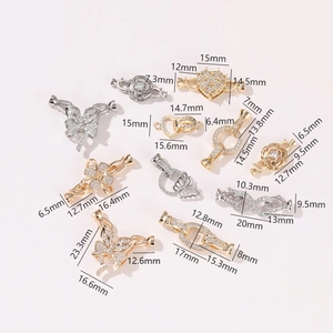 Detailed view of various gold and silver magnetic jewelry clasps with rhinestone inlays