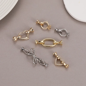 Polished gold and silver jewelry connectors in heart and bow shapes for DIY necklaces