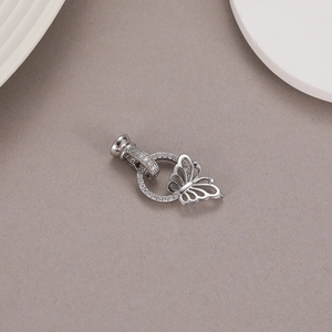 Close-up of a silver butterfly magnetic jewelry clasp with sparkling zircon stones