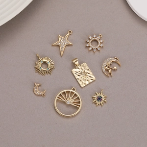 Detailed view of 14K gold plated celestial pendants with micro-set zircon for DIY jewelry