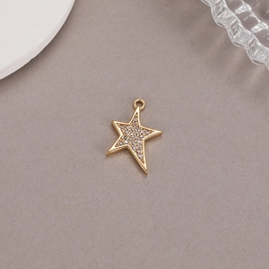Close-up of 14K gold plated star pendant with sparkling cubic zirconia micro-pave details
