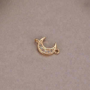 Detailed view of a 14K gold plated crescent moon charm with cubic zirconia for DIY jewelry