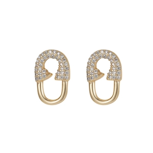Golden U-shaped safety pin earrings with sparkling white zircons and modern design