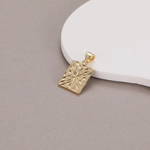 Elegant 14K gold plated rectangular pendant with celestial sunburst star pattern