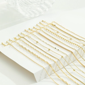 Assorted gold-plated necklaces set including box, bead, and snake chains with lobster clasps