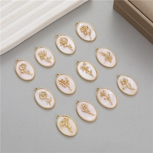 Set of twelve 14k gold-filled oval flower birthstone pendants with mother-of-pearl inlay